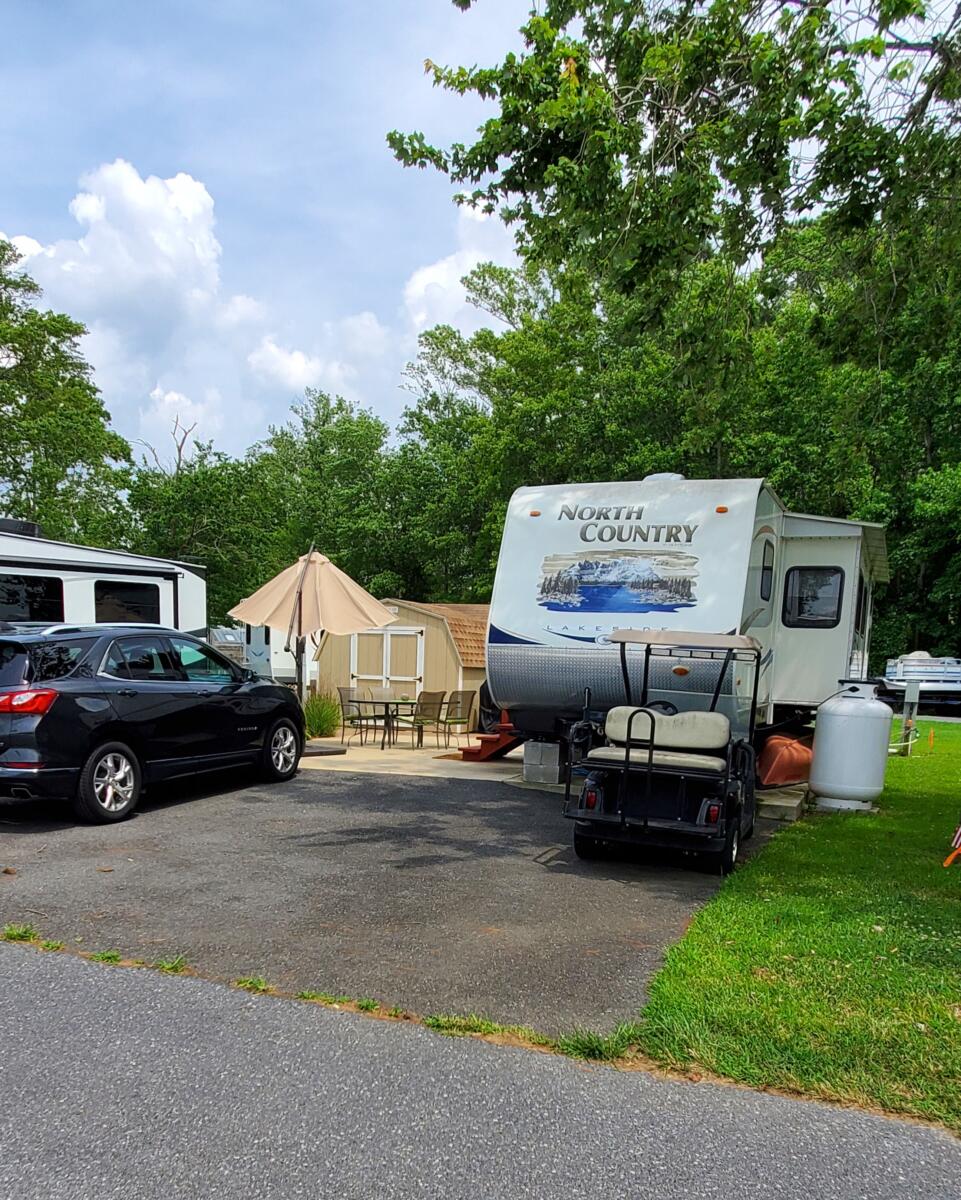 Lot-26 $85,000.  Lot, camper, golf cart, shed , fema pad, patio, grill, lawnmower, furnishings and  more. 64.31' at street 50' right side,40' at back, 20.72' left corner and 41.82' left side to street
